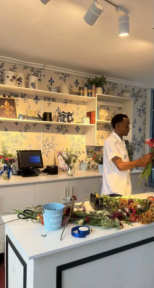 The florist's corner at Maison, fresh stems on the white counter